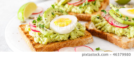 Toasts with avocado guacamole, fresh radish 46379980