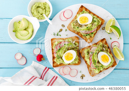 Toasts with avocado guacamole, fresh radish 46380055