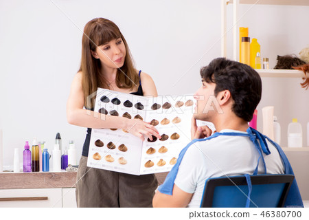 Young attracrive man visiting female barber  46380700
