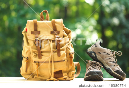 A backpack with hiking boots A backpack with hiking boots 46380754