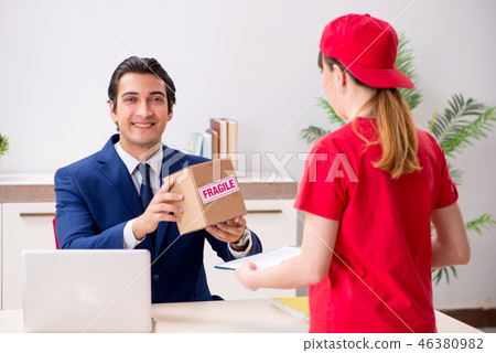 Courier delivering parcel to the office Courier delivering parcel to the office 46380982
