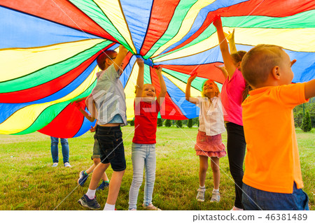 Fun and joy under colorful tent outdoors in the summer 46381489