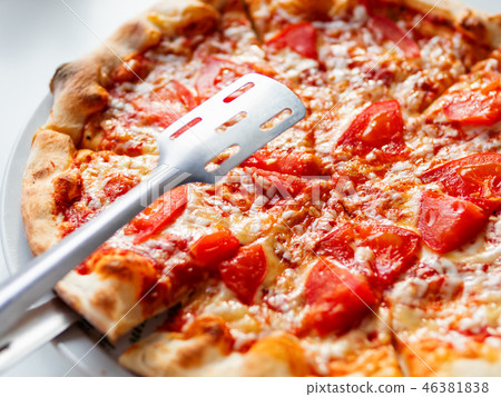 Italian pizza Margarita with cheese, tomato, ham Italian pizza Margarita with cheese, tomato, ham 46381838