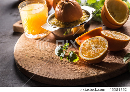 Fresh oranges juicer juice and tropical fruits. 46381862