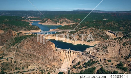 Aerial view of bridges and dam in mountainous area of Spain 46385644