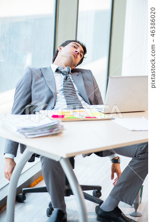 Young successful businessman working at the office Young successful businessman working at the office 46386020