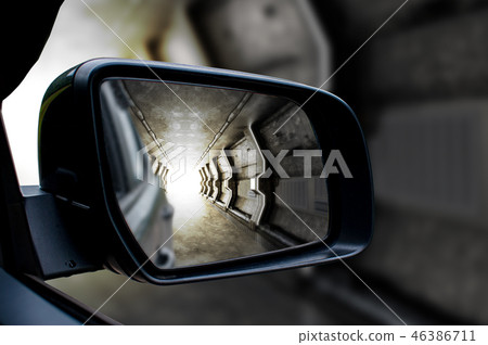 Tunnel in the sideview mirror of a car. 46386711