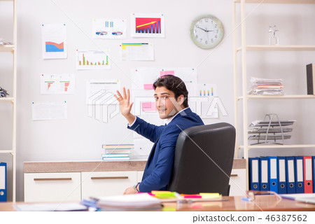 Young handsome sales anayst working at the office 46387562