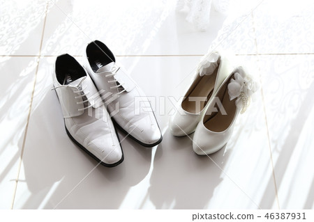Bride and groom bridal shoes 46387931