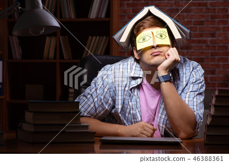 Young handsome student preparing for exams at night  46388361