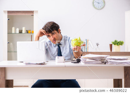 Man under stress measuring his blood pressure 46389022