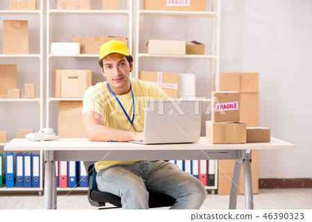 Handsome contractor working in box delivery relocation service Handsome contractor working in box delivery relocation service 46390323