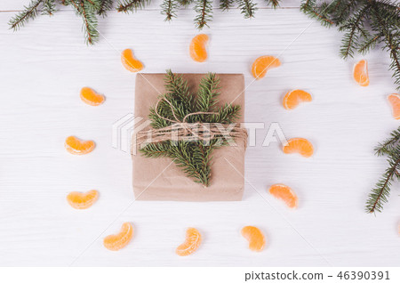 Christmas gift box on a white wooden background. 46390391