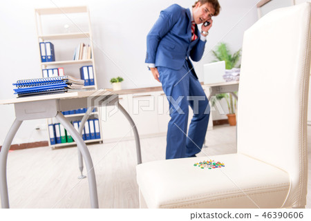 Office prank with sharp thumbtacks on chair Office prank with sharp thumbtacks on chair 46390606