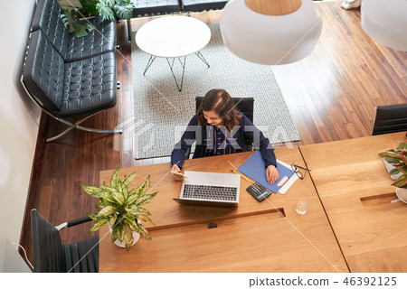 Business lady checking messages Business lady checking messages 46392125