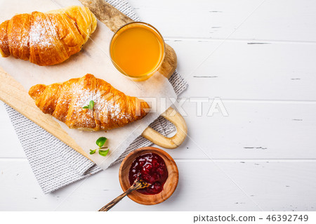 Croissants with berry jam on white background. Croissants with berry jam on white background. 46392749