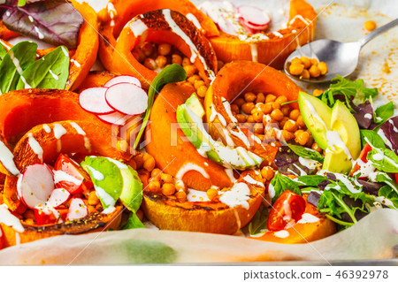 Baked pumpkin with chickpeas on a baking sheet Baked pumpkin with chickpeas on a baking sheet 46392978