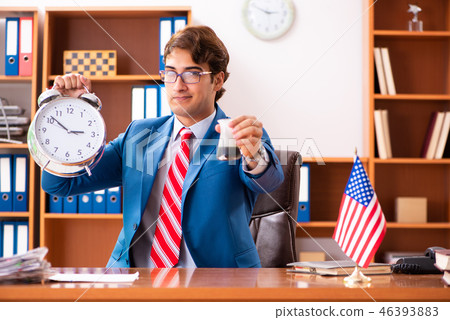 Young handsome politician sitting in office  46393883