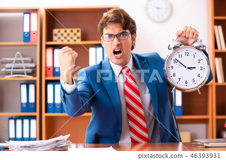 Young handsome politician sitting in office Young handsome politician sitting in office 46393931