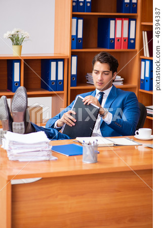 Young employee working in the office Young employee working in the office 46394387