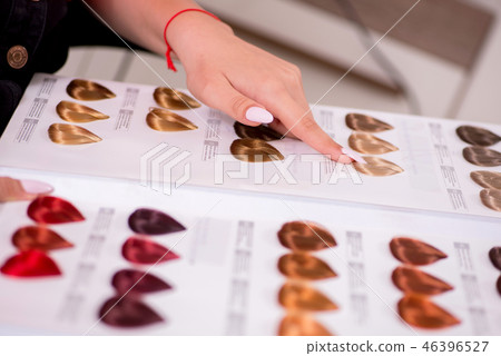 Customer choosing colour for her hair Customer choosing colour for her hair 46396527