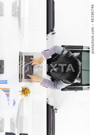 Businesswoman working on computer. Businesswoman working on computer. 46396746