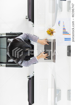 Happy business woman in office. 46396747