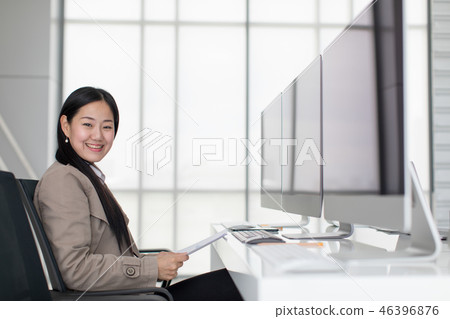 Happy woman in office. 46396876