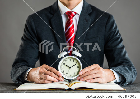 Businessman and watch studio shot 46397003