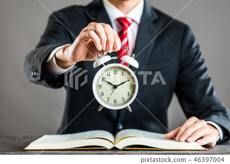 Businessman and watch studio shot 46397004