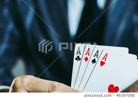 Businessman's hand holding playing cards Close-up studio shot 46397098