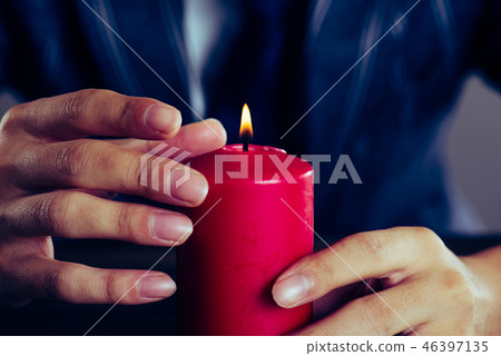 Red candle and men 46397135