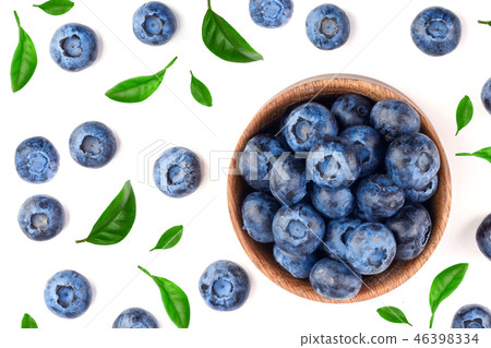 fresh ripe blueberry with leaf in wooden bowl isolated on white background. Top view. Flat lay fresh ripe blueberry with leaf in wooden bowl isolated on white background. Top view. Flat lay 46398334