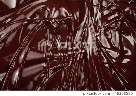 Melted chocolate swirl as a background closeup Melted chocolate swirl as a background closeup 46398590