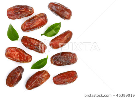 dry dates with green leaves isolated on white background with copy space for your text. Top view dry dates with green leaves isolated on white background with copy space for your text. Top view 46399019