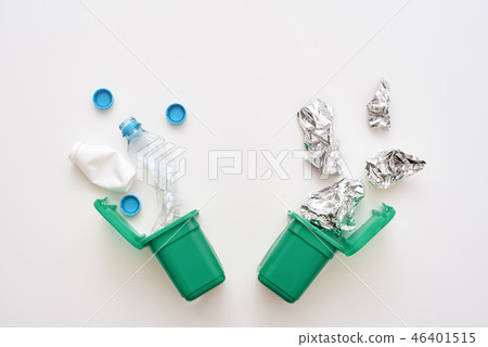 Foil and plastic. Crumple foil and plastic falling to the recycling bin 46401515