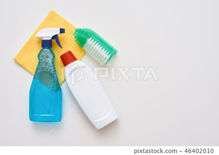 Cleaning tools. Spray bottle and orange cleaner cloth and brush isolated Cleaning tools. Spray bottle and orange cleaner cloth and brush isolated 46402010