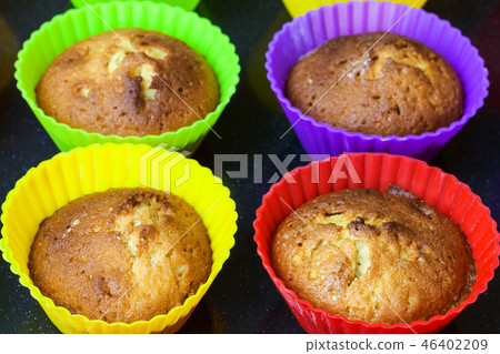 cupcakes in multicolored silicone molds close up cupcakes in multicolored silicone molds close up 46402209