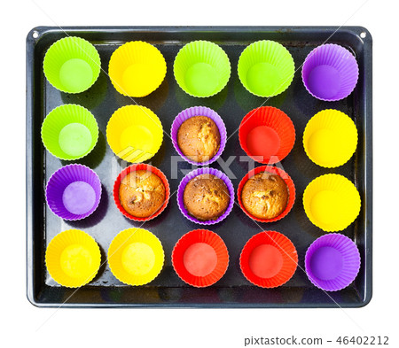 top view of tray with few baked cupcakes in molds top view of tray with few baked cupcakes in molds 46402212