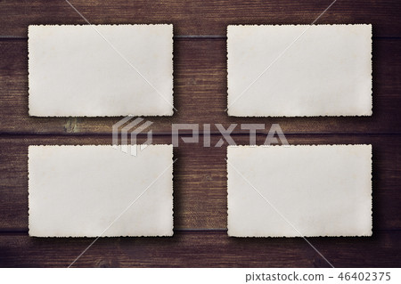 Four vintage photos on the wooden desk 46402375