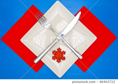 White square plate and red Christmas decoration 46403722