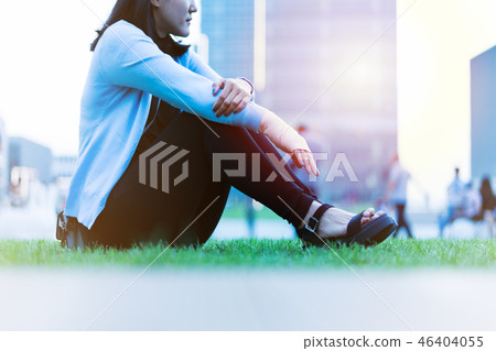 wrist hand pain women sit on the green grass wrist hand pain women sit on the green grass 46404055