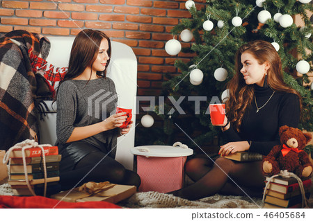 Brunettes in a christmas room Brunettes in a christmas room 46405684