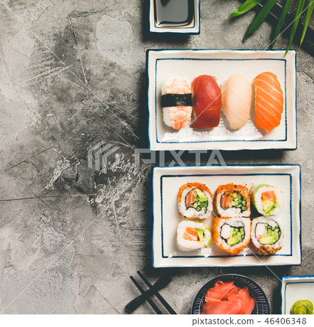 Flat-lay of sushi set on grey concrete background, square composition 46406348