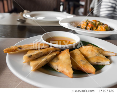 close up of crispy spring roll stuffed with prawns 46407580