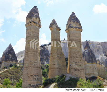 Large phallic mountain rock towers in the valley Large phallic mountain rock towers in the valley 46407981