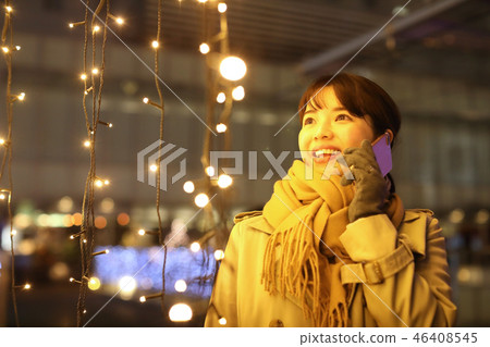 Woman talking on smartphone Woman talking on smartphone 46408545
