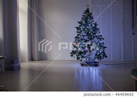 Christmas tree in the Interior of the white room gifts new year holiday Garland lights Christmas tree in the Interior of the white room gifts new year holiday Garland lights 46409692