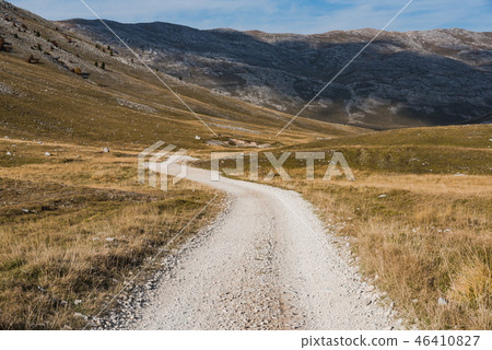 Rural road through autumn steppe, Bosnia Rural road through autumn steppe, Bosnia 46410827