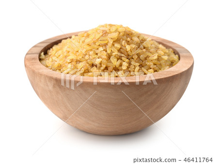 Wooden bowl full of bulgur 46411764